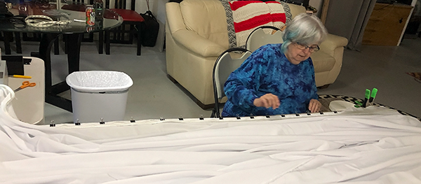 Zita Gillis sews the Pavilion screen